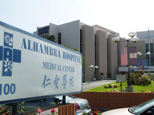 Picture showing exterior of Alhambra Hospital Medical Center and the Hospital sign in front of the Hospital.
