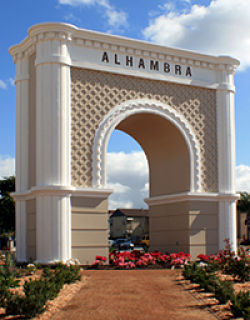 Picture of large arch that says ALHAMBRA on it.
